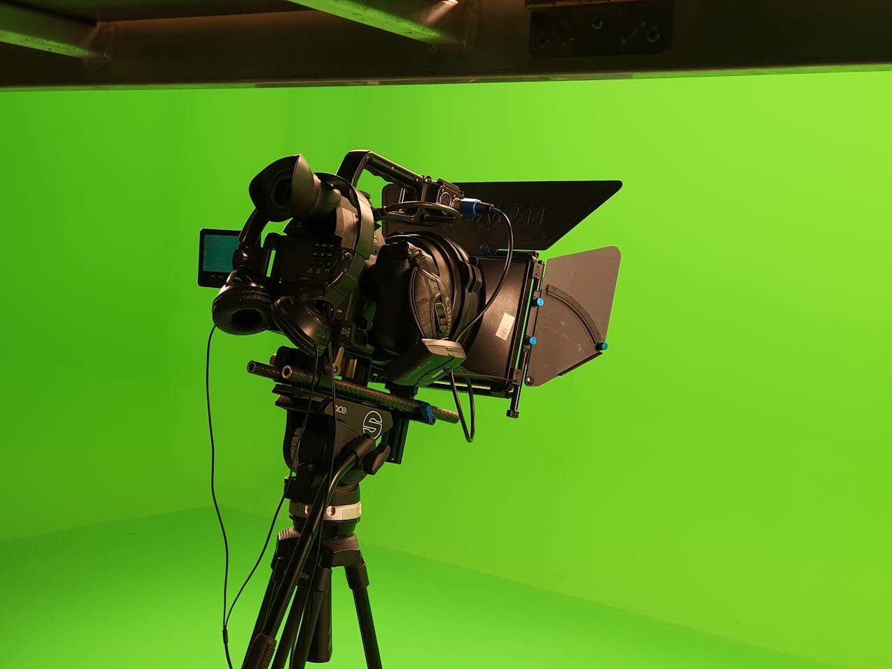 High-quality video camera setup in a green screen studio, ideal for film production.